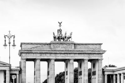 Low angle view of triumphal arch against sky