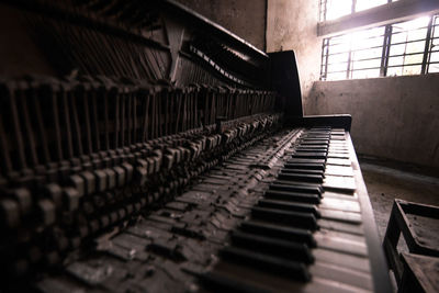 Close-up of abandoned piano