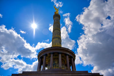 Low angle view of bell tower against sky