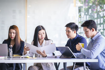 Group of people working on mobile phone