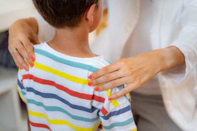 Children physical exam. checking posture and spine development