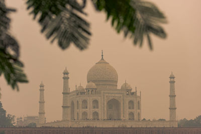 Low angle view of taj mahal against clear sky during sunset