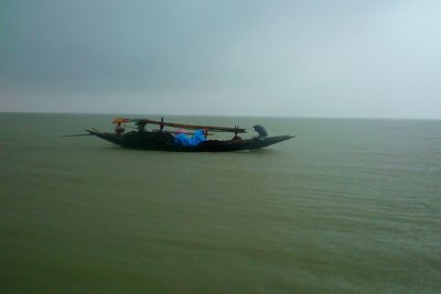 Boat in sea against sky