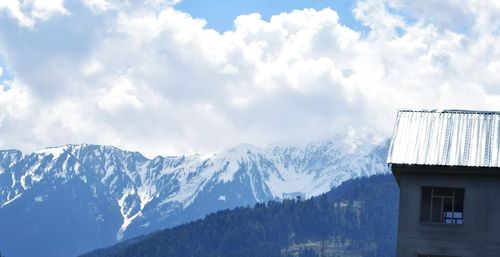 Scenic view of snowcapped mountains against sky