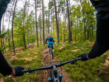 Man riding bicycle in forest