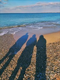 Shadow of woman on beach