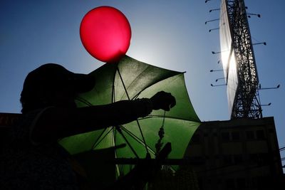 Low angle view of balloons against sky