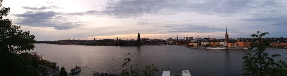 High angle view of river by buildings against sky