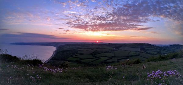 Scenic view of sea at sunset