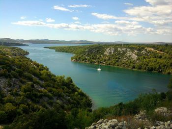 Scenic view of landscape against cloudy sky