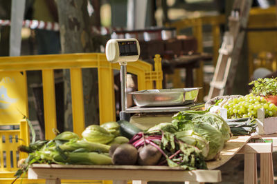 Various vegetables and fruits for sale at market stall