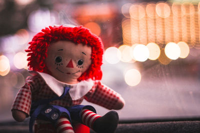 Close-up portrait of cute girl in toy