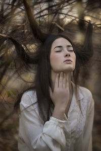 Portrait of young woman looking away