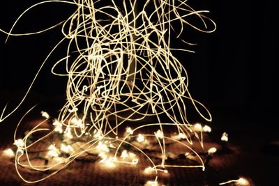 Low angle view of light trails at night