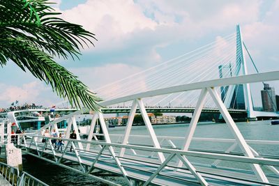 View of bridge over sea against cloudy sky