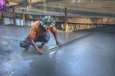 Craftsmen plastering with tools