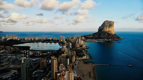 High angle view of sea and buildings against sky