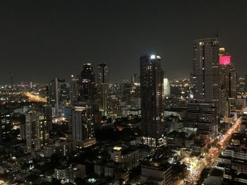 High angle view of illuminated buildings in city at night