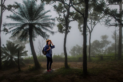 Full length of woman standing on field