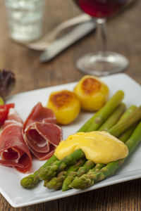 High angle view of fruits in plate on table