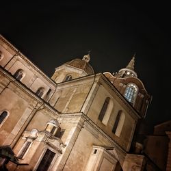 Low angle view of building against sky at night