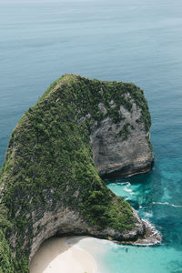 High angle view of rocks in sea