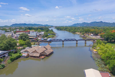 High angle view of river amidst buildings against sky