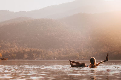 Man surfing in lake