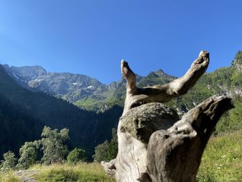 Scenic view of mountains against clear blue sky