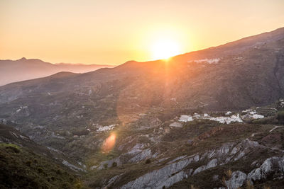 Scenic view of mountains against sky during sunset