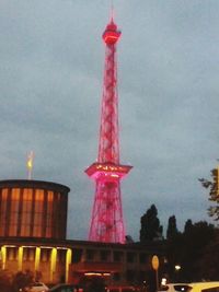 Low angle view of communications tower against sky