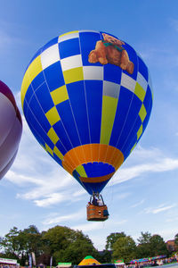 Low angle view of hot air balloons against sky