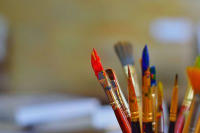 Close-up of paintbrushes in container