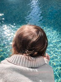 High angle view of woman by swimming pool