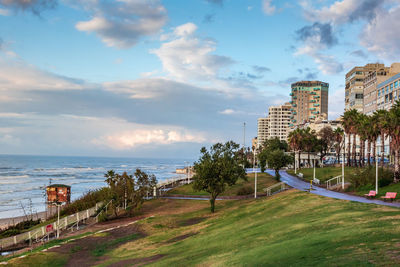 Scenic view of sea by buildings against sky. bat yam, israel.