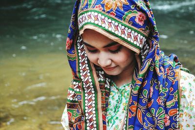 Close-up of young woman in water