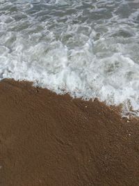 High angle view of surf on beach