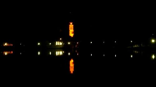 Reflection of illuminated buildings in water