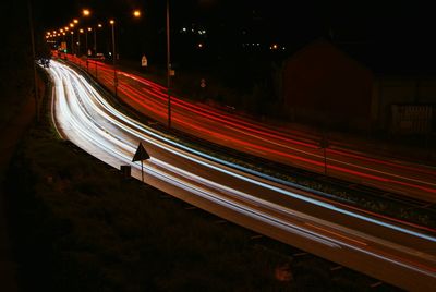 High angle view of light trails on road at night