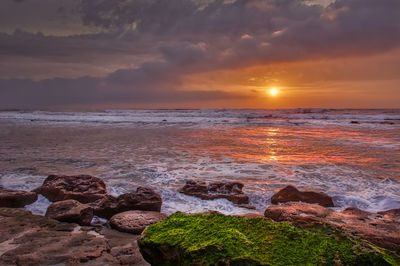 Scenic view of sea against sky during sunset