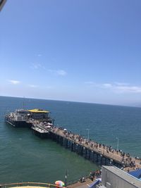 High angle view of sea against blue sky