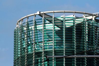 Low angle view of modern building against clear blue sky