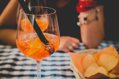 Close-up of orange juice on table