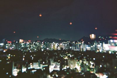 Illuminated cityscape at night