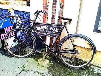 Bicycle parked against pole