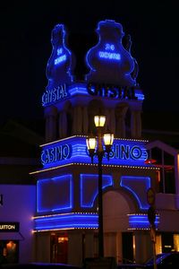 Low angle view of illuminated building at night