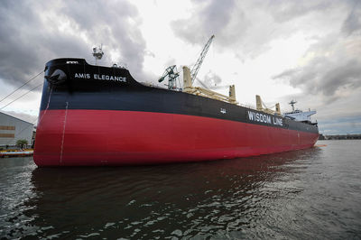 Ship moored on sea against sky