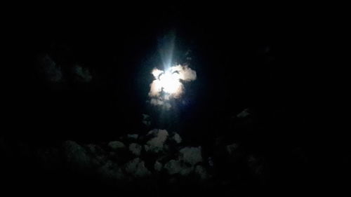 Low angle view of illuminated lights at night
