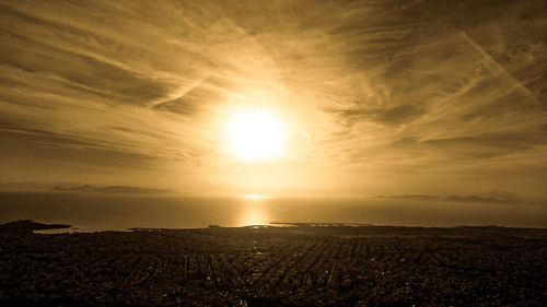 Scenic view of field against sky during sunset