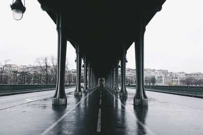 Bridge against sky in city